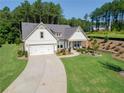 Attractive single Gathering home with well-manicured lawn and two car garage at 400 Southland Cir, Canton, GA 30115