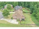 Aerial view of home showcasing backyard, mature trees, and surrounding neighborhood at 602 Davenport Pl, Canton, GA 30115