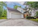 Home with a two-car garage, and a well-manicured lawn and bushes in front at 2341 Alden, Jonesboro, GA 30236