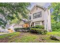 Two-story home featuring neutral siding, well-maintained landscaping, and an attached garage at 2341 Alden, Jonesboro, GA 30236