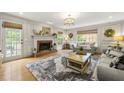 Cozy living room with a brick fireplace, neutral decor, and ample natural light at 4343 Sprucebough Dr, Marietta, GA 30062