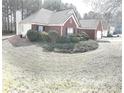 Brick home featuring large manicured landscaped yard at 40 Pebble Brooke Ct, Covington, GA 30016