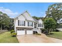 Charming two-story home with a two car garage and a stone foundation at 108 Faraday Dr, Douglasville, GA 30134