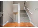 Inviting foyer featuring wood floors, stairs to the upper level, and access to the lower level at 1501 Buckingham, Stockbridge, GA 30281