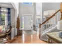 Inviting foyer with high ceilings, hardwood floors, and an elegant staircase at 2804 Stillwater Park Dr, Marietta, GA 30066