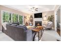 Cozy living room with fireplace, large windows, and comfortable gray sofa at 2804 Stillwater Park Dr, Marietta, GA 30066