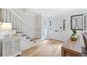 Bright entryway with hardwood floors, white trim, staircase, and ample natural light at 70 Old Ivy Ne Rd # 57, Atlanta, GA 30342