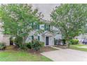 Charming two-story home with blue shutters and a welcoming front entrance at 257 Turnstone Rd, Stockbridge, GA 30281