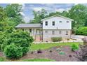 Attractive home featuring manicured lawn, brick accents, attractive landscaping and covered porch at 281 Lakeshore Ne Dr, Marietta, GA 30067