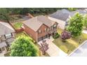 Aerial view of a home with a landscaped front yard and a two-car garage at 8744 Hamil Ct, Douglasville, GA 30135