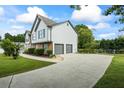 Charming two-story home with a two-car garage, landscaped yard, and inviting driveway at 4914 Watson Mill Ct, Loganville, GA 30052