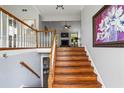 Inviting staircase with wooden steps, leading to the upper level with cozy interiors at 4914 Watson Mill Ct, Loganville, GA 30052