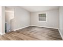 Spacious living room with modern, durable wood-look flooring and neutral paint, offering a bright and inviting space at 1034 Sandy Ridge Rd, Mcdonough, GA 30252
