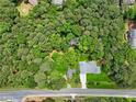 An aerial perspective shows a home and its surroundings, with lush trees offering plenty of shade at 905 John Ward Rd, Marietta, GA 30064