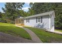 Well-manicured lawn leading to the home's side entrance, highlighting the clean lines and landscaping at 4070 Feather Dr, Douglasville, GA 30135