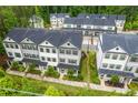 Overhead view of a modern townhome community featuring well-maintained landscaping at 429 Stovall Pl, Woodstock, GA 30188