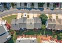 An aerial view captures the neighborhood's layout with visible roofs, trees, and back patios at 6004 Turfway Park Ct, Sugar Hill, GA 30518