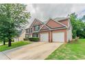 Handsome brick home with a two-car garage and manicured landscaping at 7190 Cavender Sw Dr, Atlanta, GA 30331