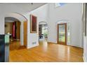 Bright foyer with gleaming hardwood floors and tall ceilings that create an inviting entry space at 2700 Still Farms Ct, Lawrenceville, GA 30043
