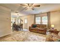 Open concept living and dining area with lots of natural light and comfortable seating at 336 Freeman Cir, Villa Rica, GA 30180