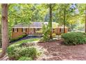 Traditional brick home with well-manicured lawn and lush landscaping at 2166 Lake Ridge Ter, Lawrenceville, GA 30043