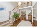 Spacious foyer features hardwood floors, a staircase, and a view into the living room at 4750 Freeport Bay Ne, Roswell, GA 30075