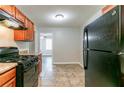 Functional kitchen boasts matching appliances, laminate countertops, and ample cabinet space at 61 Springside Se Dr, Atlanta, GA 30354