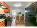 Bright kitchen with dining area featuring modern table set and adjacent living area at 61 Springside Se Dr, Atlanta, GA 30354