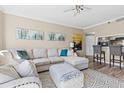Spacious living room with ample seating, soft rug, and view into the kitchen at 1 Biscayne Nw Dr # 804, Atlanta, GA 30309