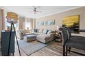 Comfortable living room with a large sectional sofa, stylish rug, and a decorative floor lamp at 1 Biscayne Nw Dr # 804, Atlanta, GA 30309