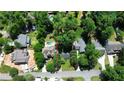 Aerial view of a beautiful residential lot surrounded by mature trees in an established neighborhood with swimming pools nearby at 1891 8Th St, Atlanta, GA 30341