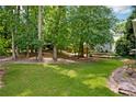 Lush backyard with mature trees, providing ample shade and privacy for outdoor enjoyment at 1891 8Th St, Atlanta, GA 30341