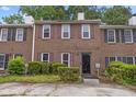 Charming brick townhouse featuring well-maintained landscaping and a welcoming entrance at 244 Timber Creek Sw Ln, Marietta, GA 30060