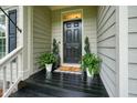 Charming front porch with decorative plants and a welcoming doormat at 3286 Crawford Cir, Marietta, GA 30066