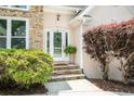 Inviting front entrance with stone steps leading to the glass front door at 1275 Kelly Nelson Dr, Lawrenceville, GA 30043