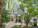 Backyard patio with stone floors, a balcony, and outdoor furniture at 2054 Palifox Ne Dr, Atlanta, GA 30307