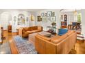 Bright living room with hardwood floors, stylish sofas, and open layout leading to the dining area at 2054 Palifox Ne Dr, Atlanta, GA 30307