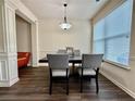 Dining area with contemporary lighting and furniture; large window provides natural light at 2351 Attewood Dr, Buford, GA 30519