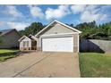 The home's exterior features a two-car garage, neutral siding, stone accents, and well-kept landscaping at 109 Rockefeller Ln, Dallas, GA 30157