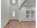 Bright foyer with hardwood floors, white walls, and ample natural light at 4495 Hedgewood Dr, Cumming, GA 30041