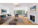 Comfortable living room showcases hardwood floors, a cozy fireplace, and plenty of natural light at 1105 Pine Heights Ne Dr, Atlanta, GA 30324