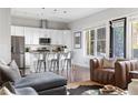 Open-concept kitchen with stainless steel appliances, island seating, and modern finishes at 1195 Milton Se Ter # 5101, Atlanta, GA 30315