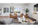Cozy living area with large windows offering scenic views and comfortable leather seating at 1195 Milton Se Ter # 5101, Atlanta, GA 30315