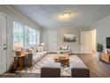 Bright living room features hardwood floors, natural light, and neutral decor at 2046 Rector Sw Dr, Atlanta, GA 30311
