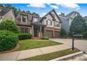 Charming two-story home with manicured lawn, brick accents, and a welcoming front porch at 3725 Paces Park Se Cir, Smyrna, GA 30080