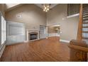 Spacious living room with high ceilings, fireplace, built-in bookshelves, and wood floors at 3725 Paces Park Se Cir, Smyrna, GA 30080