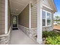 Inviting front entrance showcasing stone accents and a well-lit walkway to a sleek front door at 2012 Ripple Park Bend, Canton, GA 30114