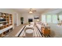 Staged living room with fireplace, neutral walls, and a bright seating area at 2799 Lake Jodeco Rd, Jonesboro, GA 30236