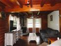 Comfortable living room features wood beams, a fireplace, and plenty of natural light at 3096 Campground Rd, Winston, GA 30187