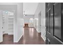 Inviting entryway showcasing wood floors, a brick fireplace and lots of natural light at 46 Centerport Dr, White, GA 30184